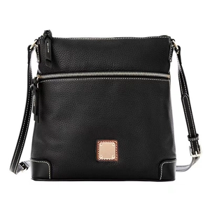 Detail of black pebbled leather crossbody bag featuring white contrast stitching and gold zipper