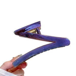Zigzag hair claw clip in purple blue starry gradient with gold metal spring detail
