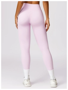 Detail showing high-waist design and Y-shaped lifting seam on pink yoga leggings