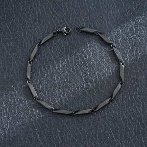Close-up of matte black stainless steel chain bracelet with geometric links for men