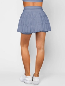 Rear view of layered blue-grey mesh pleated mini skirt with secure built-in lining
