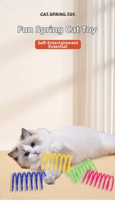 Action shot of a fluffy cat playing with colorful plastic spring toys in a cozy home