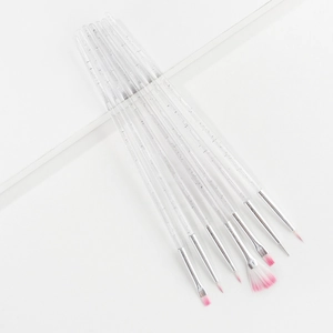 Detail of 7 professional nail art brushes with clear acrylic handles and pink tips