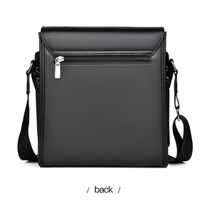 Detail view of the back of a black PU leather men's crossbody bag with zipper pocket