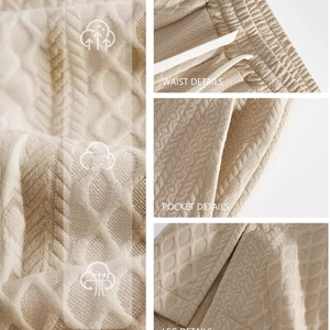 Men's beige waffle knit straight trousers with drawstring waist and pocket details