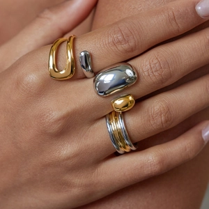 Two-tone stainless steel rings featuring irregular geometric fluid shapes for women