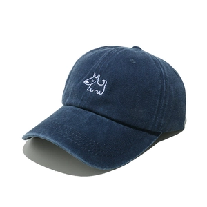 Detail of vintage washed navy corduroy baseball cap with cute puppy embroidery