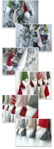 Detailed view of handmade knitted Christmas gnome ornaments in festive red and white colors
