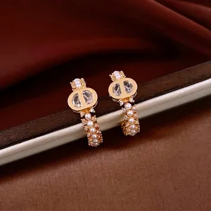 18k gold plated C-shaped earrings with pearls and crystals in designer style logo