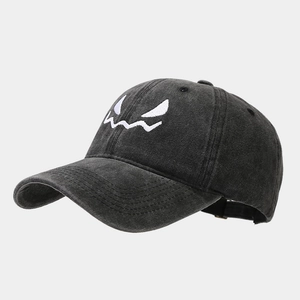 Distressed black washed cotton baseball cap featuring white skull face embroidery