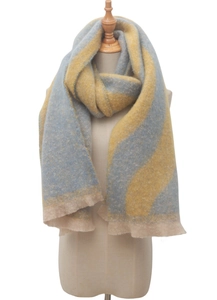 Close-up of yellow and blue wave pattern scarf with soft brushed texture and fringed edges