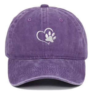 Detail of white heart and paw embroidery on vintage washed purple cotton baseball cap