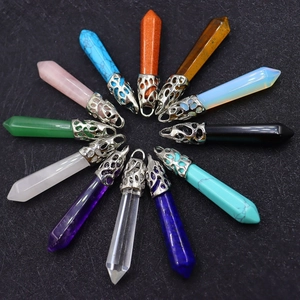 Set of 12 hexagonal crystal pendant necklaces with decorative metal caps on black texture