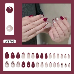 Almond leopard print press-on nails in burgundy and glitter white french cat-eye style