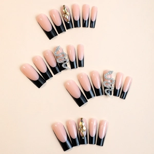 Long coffin fake nails in black French style with crystal and silver snake accents