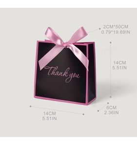 Detail of pink and black thank you gift bag with satin bow and size 14x14x6cm markings