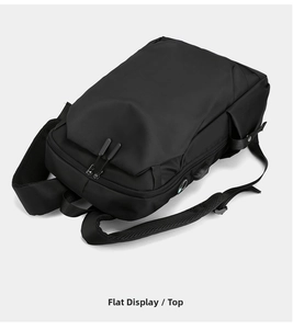 Detail of black oxford backpack with USB charging port and breathable mesh shoulder straps