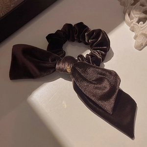 Elegant dark brown velvet hair scrunchie with large bow and gold metal detail