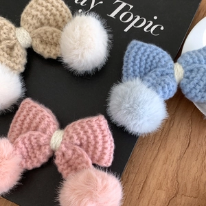Knitted bow hair clips with rabbit fur balls in beige, blue, and pink colors
