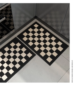 Close-up of woven checkerboard kitchen mats showing detailed non-slip texture and design