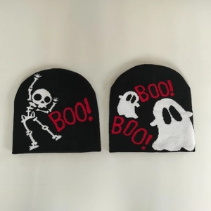 Black knitted beanie hats with white skull and ghost patterns featuring BOO lettering