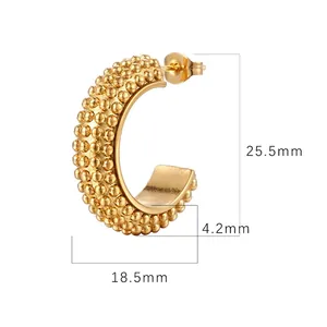 Detailed size view of golden C-shaped geometric earrings with dot texture dimensions