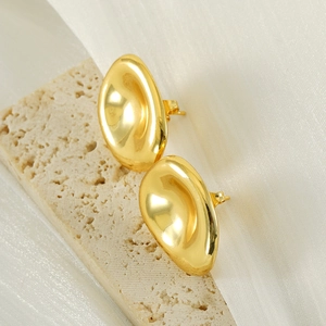 Polished 18k gold plated stainless steel stud earrings in organic bean shape on stone
