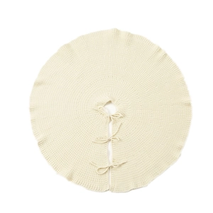 Knitted off-white Christmas tree skirt with decorative texture and tie fasteners