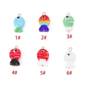 Detailed grid of six handmade colorful glass fish pendants with golden metal loops