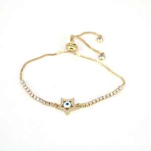 Detailed view of adjustable gold star bracelet featuring an Evil Eye motif with cubic zirconia