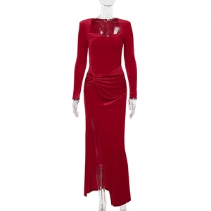 Detailed view of the red velvet dress featuring a sweetheart neckline and waist ruching