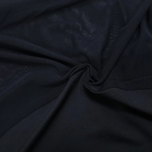 Close-up detail of sexy black mesh and sheer fabric stitching for the evening dress