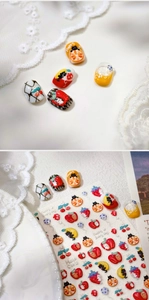 Detail of 3D embossed jelly apple and cat nail stickers with cute fruit patterns