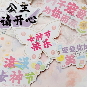 Close-up of assorted macaron-colored Christmas gift box decorative labels and tags