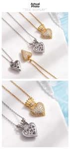 Detail of heart crown pendant necklace featuring micro-set zircons in gold and silver