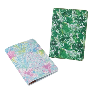 Faux leather passport covers featuring tropical green leaves and pink floral prints
