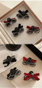 Mini velvet bow hair clips with rhinestones in red and black colors for hair styling