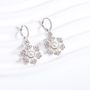 Silver snowflake drop earrings with center pearl and sparkling cubic zirconia crystals