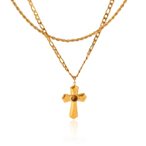 Detailed close-up of double-layer gold Figaro chain with a cross pendant and tiger eye stone
