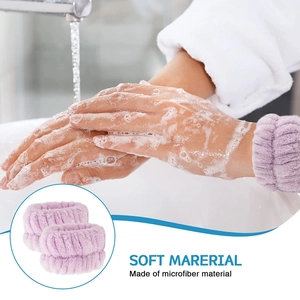 Detail showing two purple microfiber wristbands preventing water from dripping during washing
