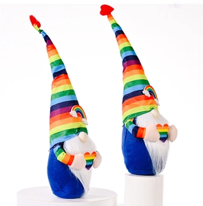 Detail shot of rainbow striped hats and colorful hearts on plush gnome dolls