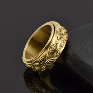 Rotating gold titanium steel eye ring with vintage punk aesthetic for men and women