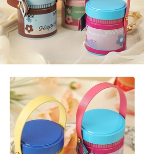Detail of round tin gift box with leather handle and rivets for wedding candy packaging
