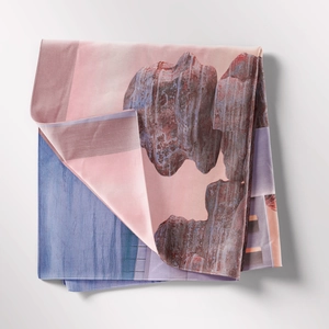 Detail of bohemian tapestry featuring abstract landscape patterns in silk-like texture
