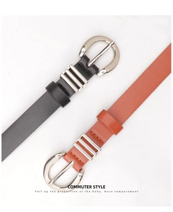 Detail of slim black and brown belts featuring silver round buckles and metal loops