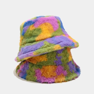 Detailed view of colorful plush faux fur winter bucket hats with soft fuzzy texture