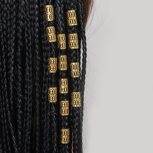 Golden hollow metal hair rings for dreadlocks decoration on black braided hair
