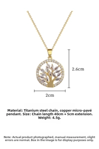 Detailed macro of gold-plated Tree of Life pendant featuring marquise-cut cubic zirconia