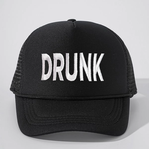 Detailed view of black trucker hat featuring white embroidered DRUNK text and breathable mesh
