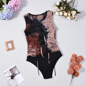 Close-up of sleeveless tie-dye bodysuit with ruched texture in dark blue and reddish brown